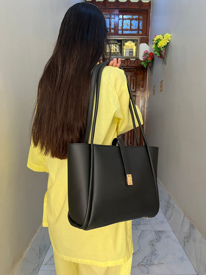 Sorrel Tote Black carried on shoulder — quiet luxury everyday bag